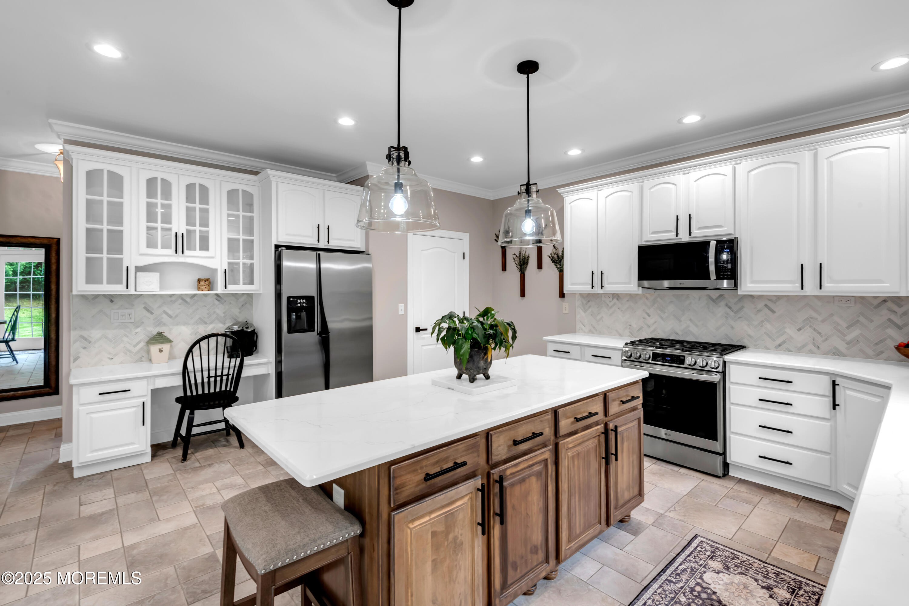 15 Conor Road Jackson, NJ 08527 - Photo 43 of 77 a kitchen with a refrigerator a stove a microwave oven a sink and a center island