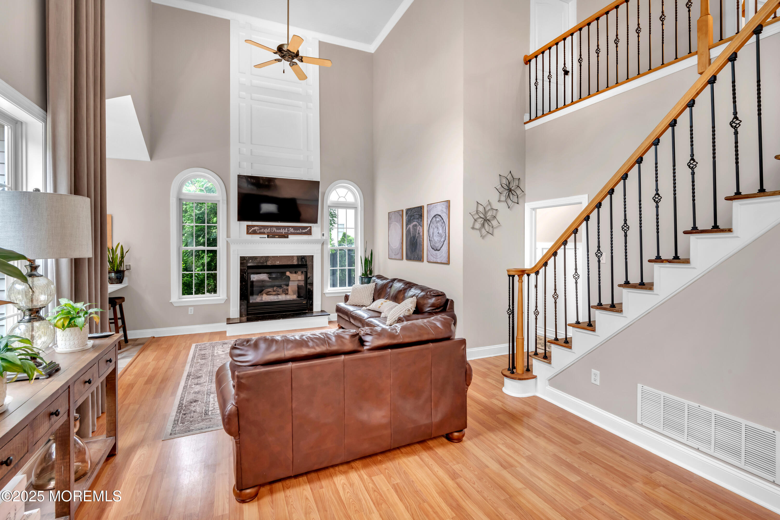 15 Conor Road Jackson, NJ 08527 - Photo 47 of 77 a living room with furniture fireplace and a flat screen tv