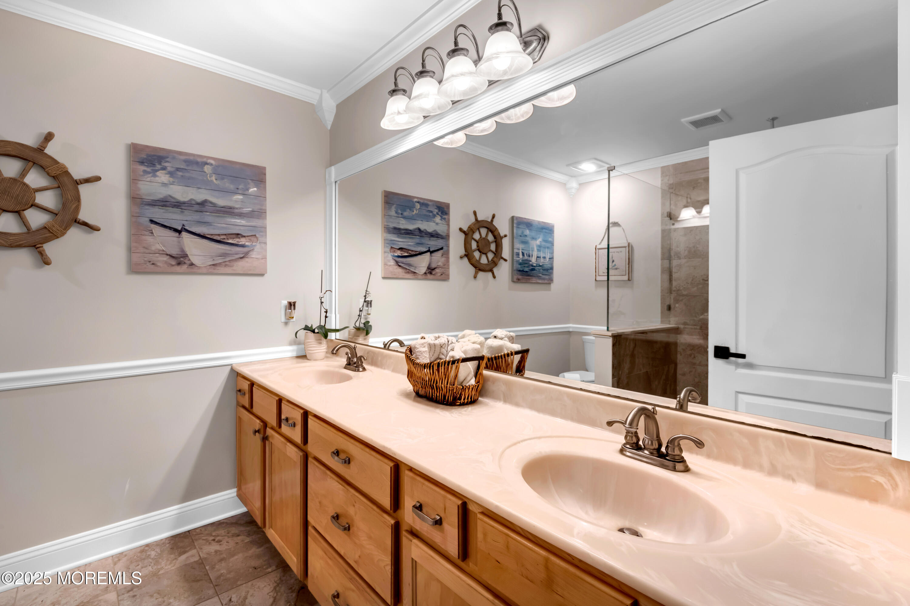 15 Conor Road Jackson, NJ 08527 - Photo 55 of 77 a bathroom with double vanity sinks a vanity a lamp and a mirror