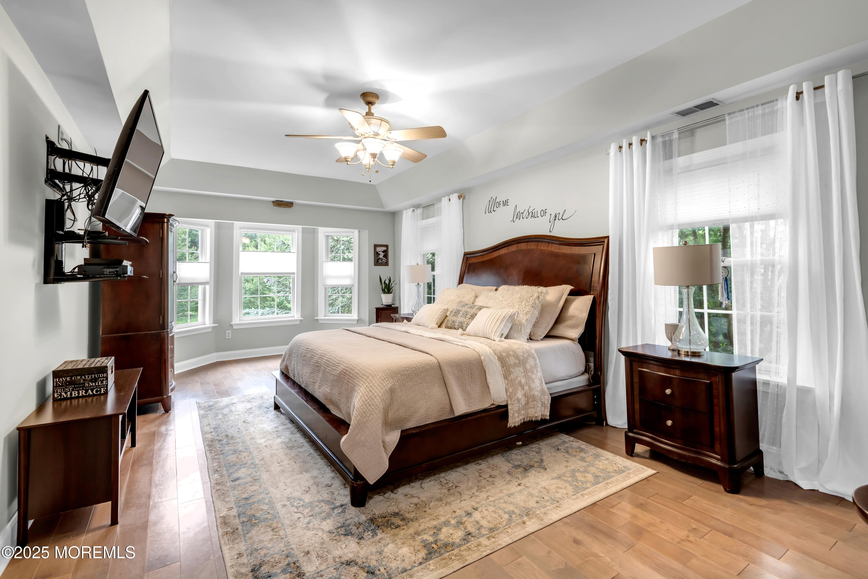 15 Conor Road Jackson, NJ 08527 - Photo 58 of 77 a bedroom with a large bed and a chandelier