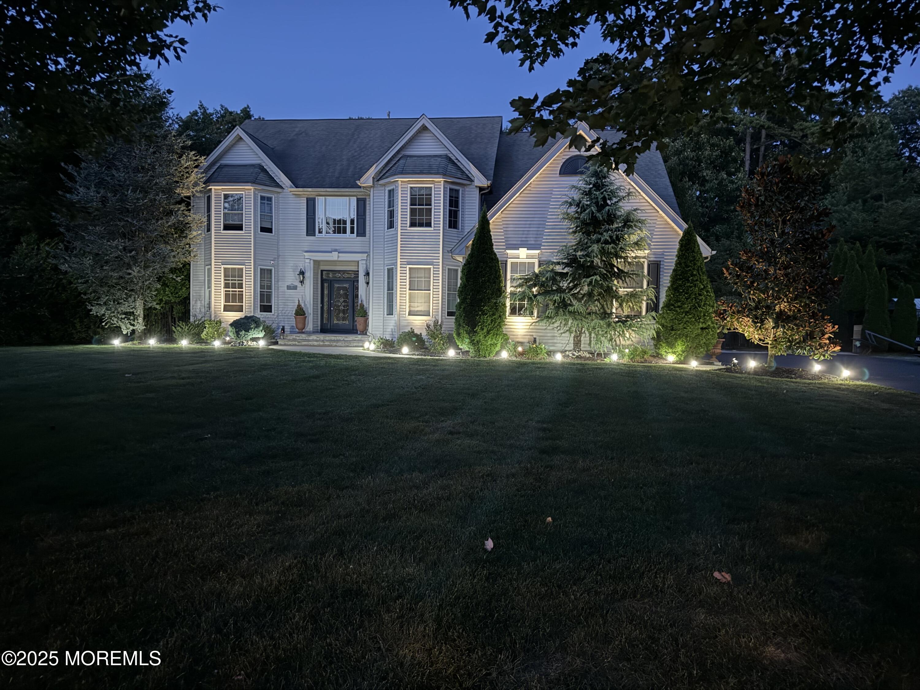 15 Conor Road Jackson, NJ 08527 - Photo 6 of 77 a front view of house along with green space