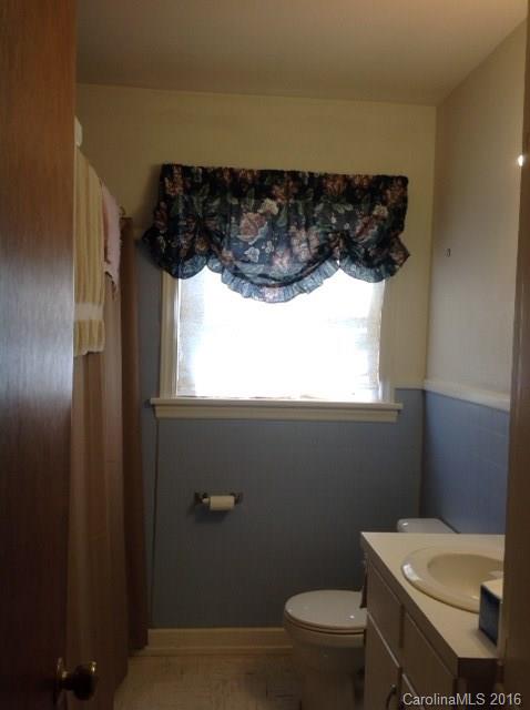 4205 River Road Hickory, NC 28602 - Photo 6 of 22 a bathroom with a toilet a sink and a window