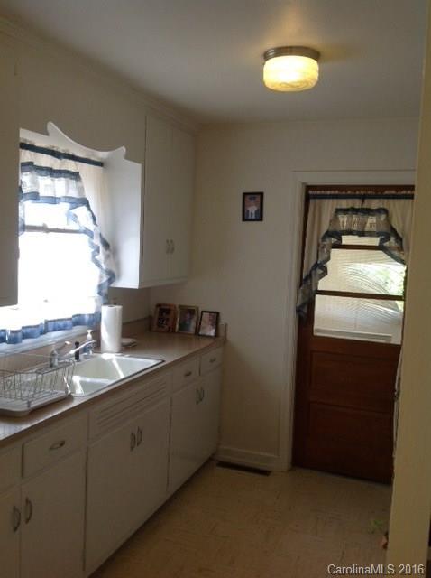 4205 River Road Hickory, NC 28602 - Photo 9 of 22 a kitchen with a sink and a refrigerator