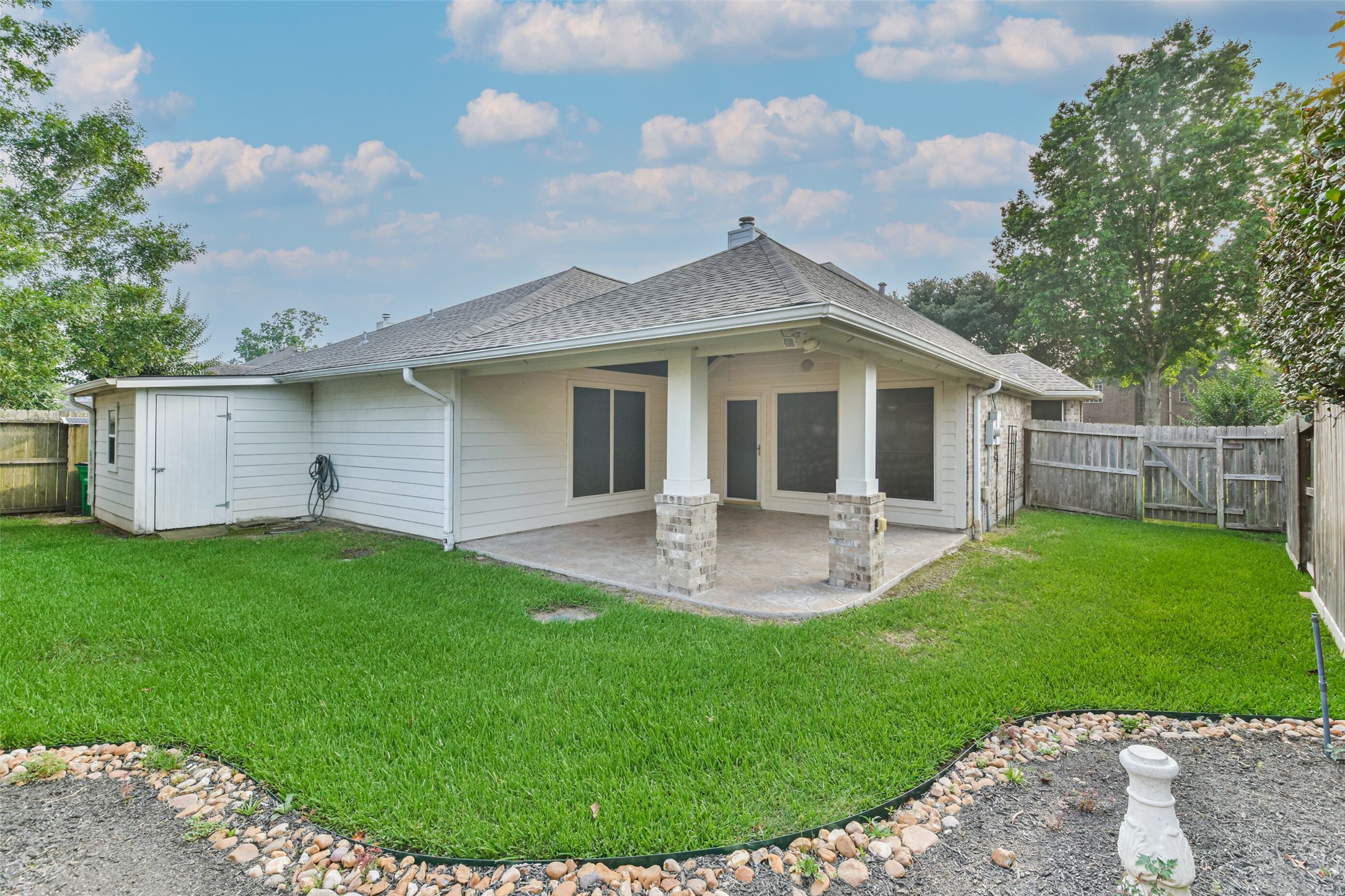 20942 Wind Field Lane Spring, TX 77379 - Photo 43 of 46 a view of a house with a backyard and porch