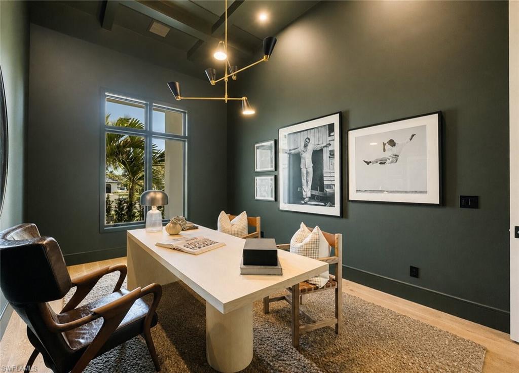 4851 Crayton Road Naples, FL 34103 - Photo 7 of 33 a view of a dining room with furniture and window