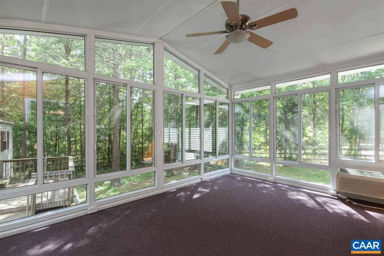 13 Deer Path Road Palmyra, VA 22963 - Photo 12 of 17 a room with yard view and a floor to ceiling window
