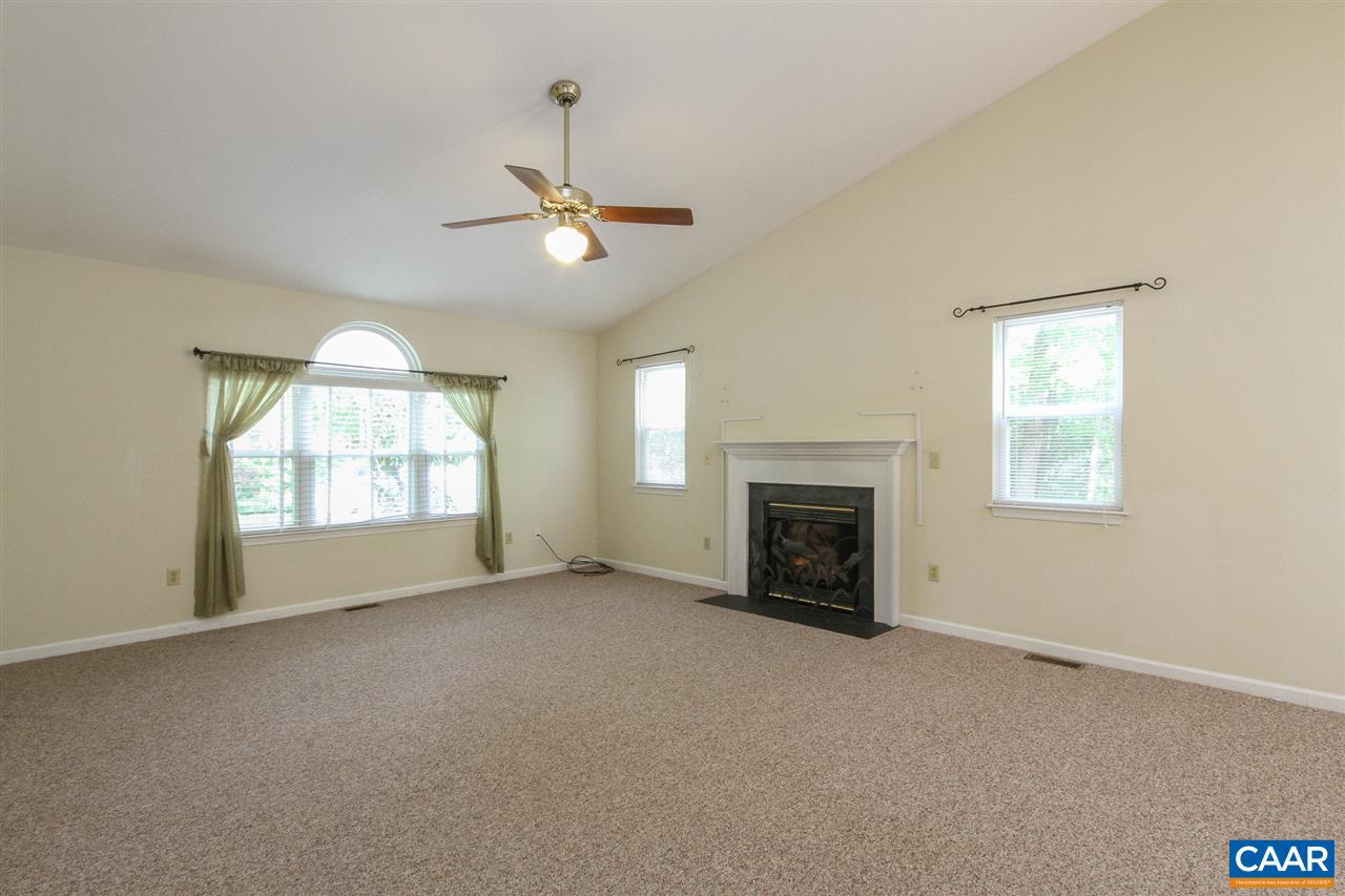 13 Deer Path Road Palmyra, VA 22963 - Photo 3 of 17 a view of empty room with fireplace and windows