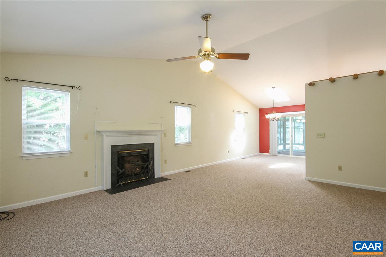 13 Deer Path Road Palmyra, VA 22963 - Photo 4 of 17 an empty room with windows and fireplace