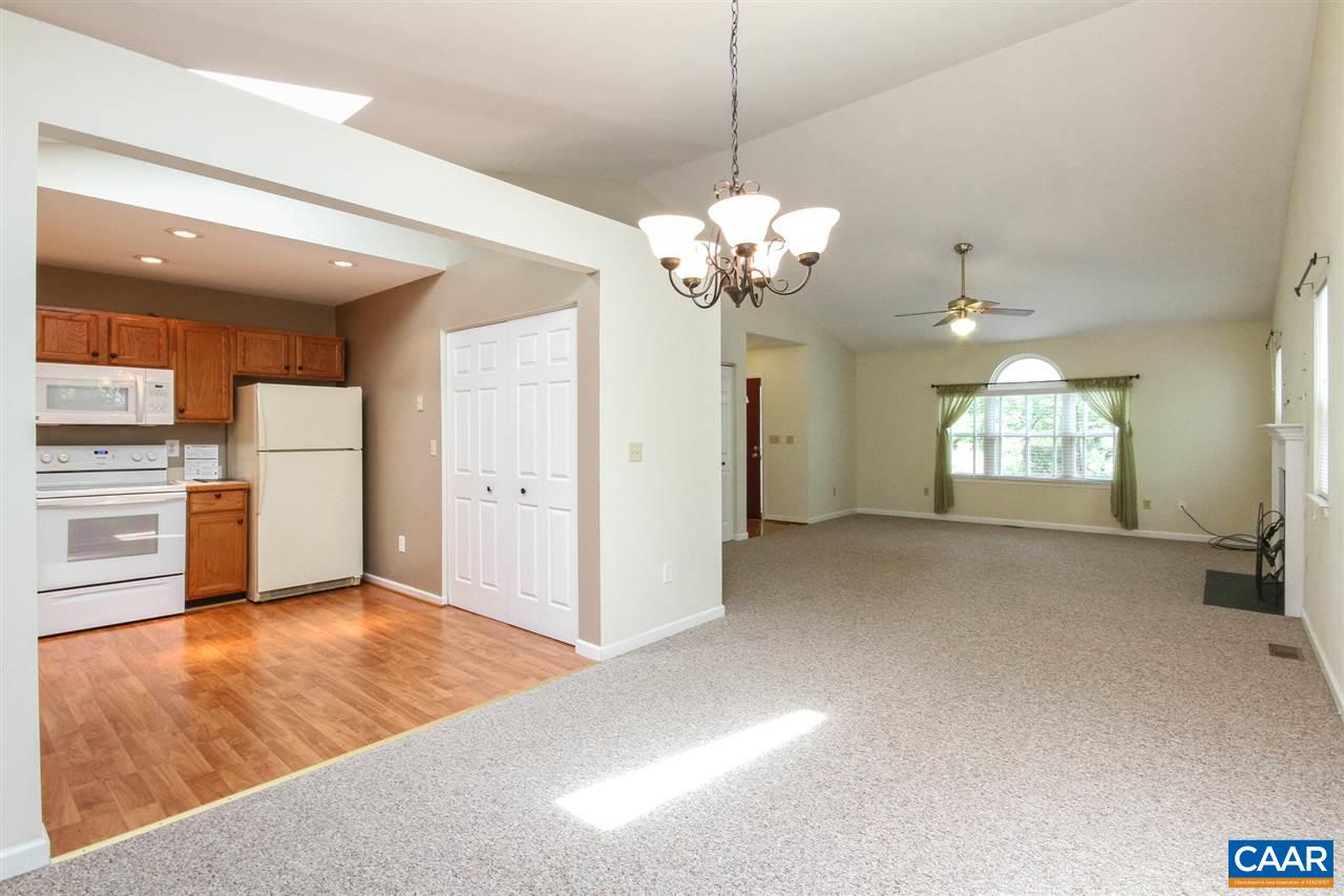 13 Deer Path Road Palmyra, VA 22963 - Photo 6 of 17 a view of an empty room with kitchen and window