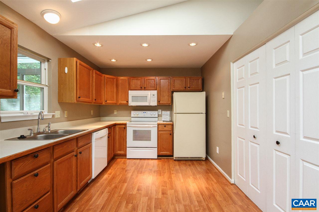 13 Deer Path Road Palmyra, VA 22963 - Photo 8 of 17 a kitchen with a sink stainless steel appliances wooden floor and cabinets