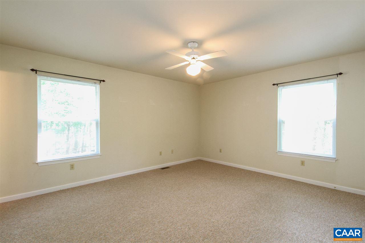 13 Deer Path Road Palmyra, VA 22963 - Photo 10 of 17 an empty room with a window and a fan