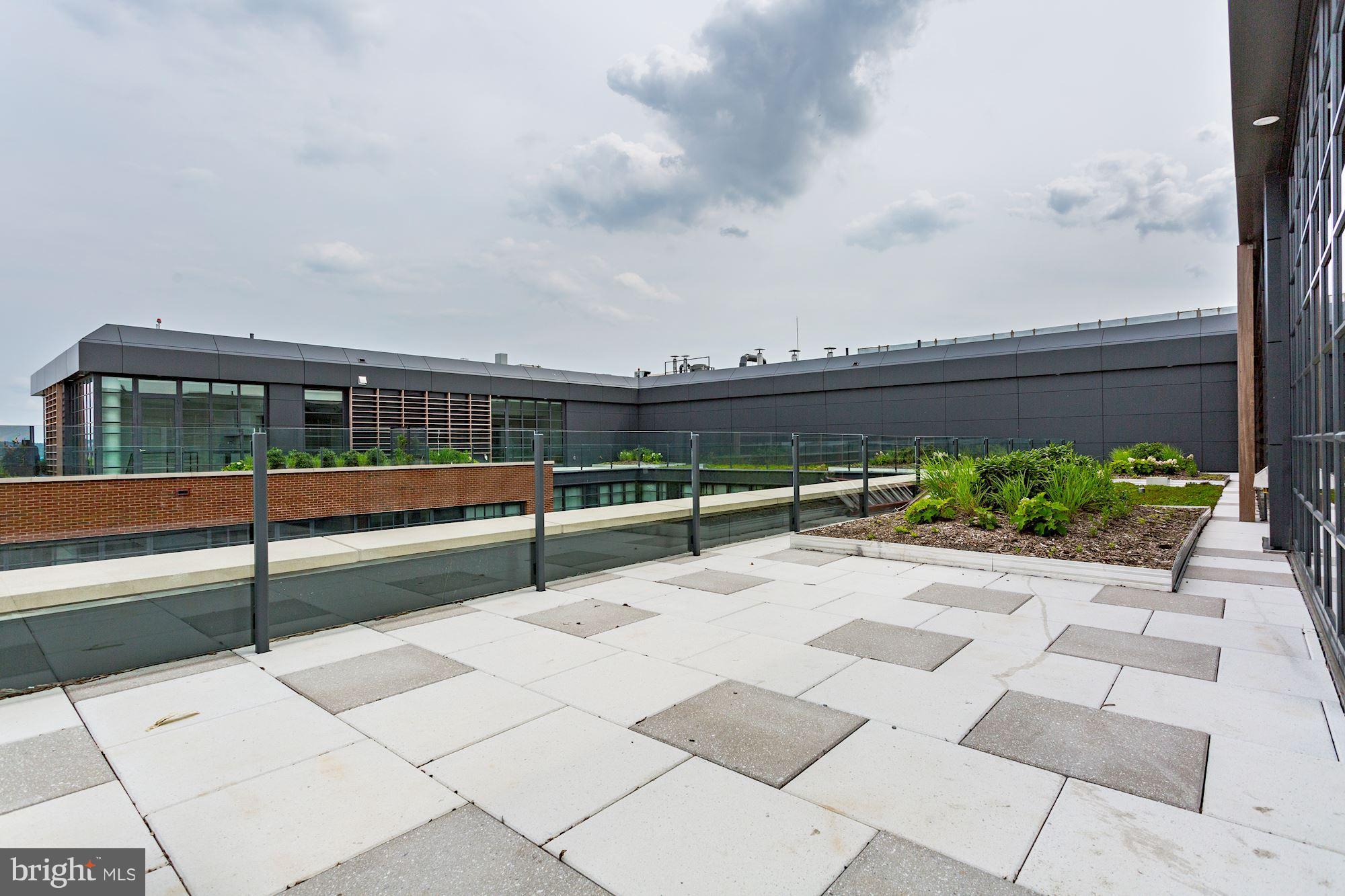 45 Sutton Square Southwest, Unit PH20 Washington, DC 20024 - Photo 16 of 21 a view of a terrace with sitting area