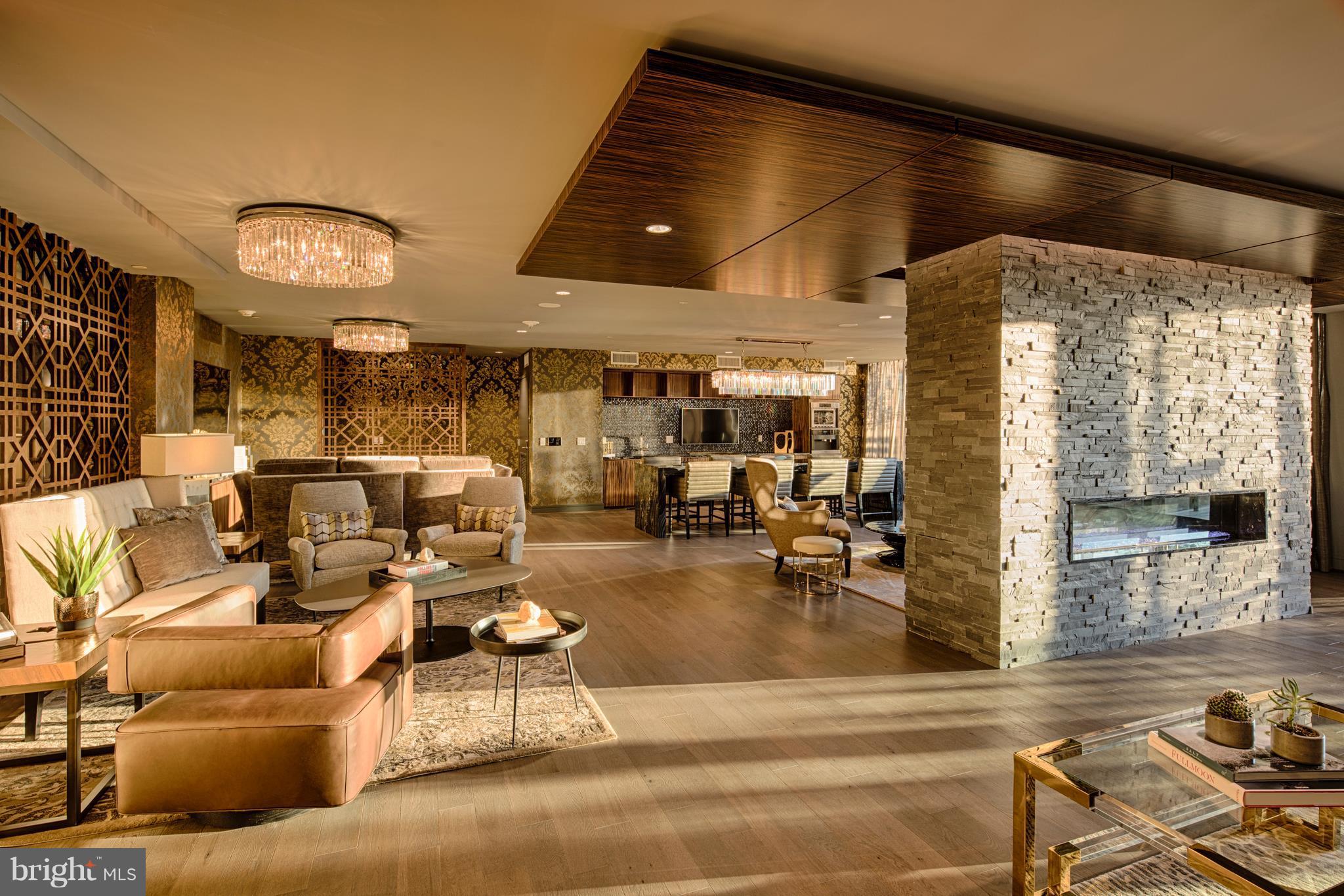 45 Sutton Square Southwest, Unit PH20 Washington, DC 20024 - Photo 19 of 21 a living room with lots of furniture and chandelier