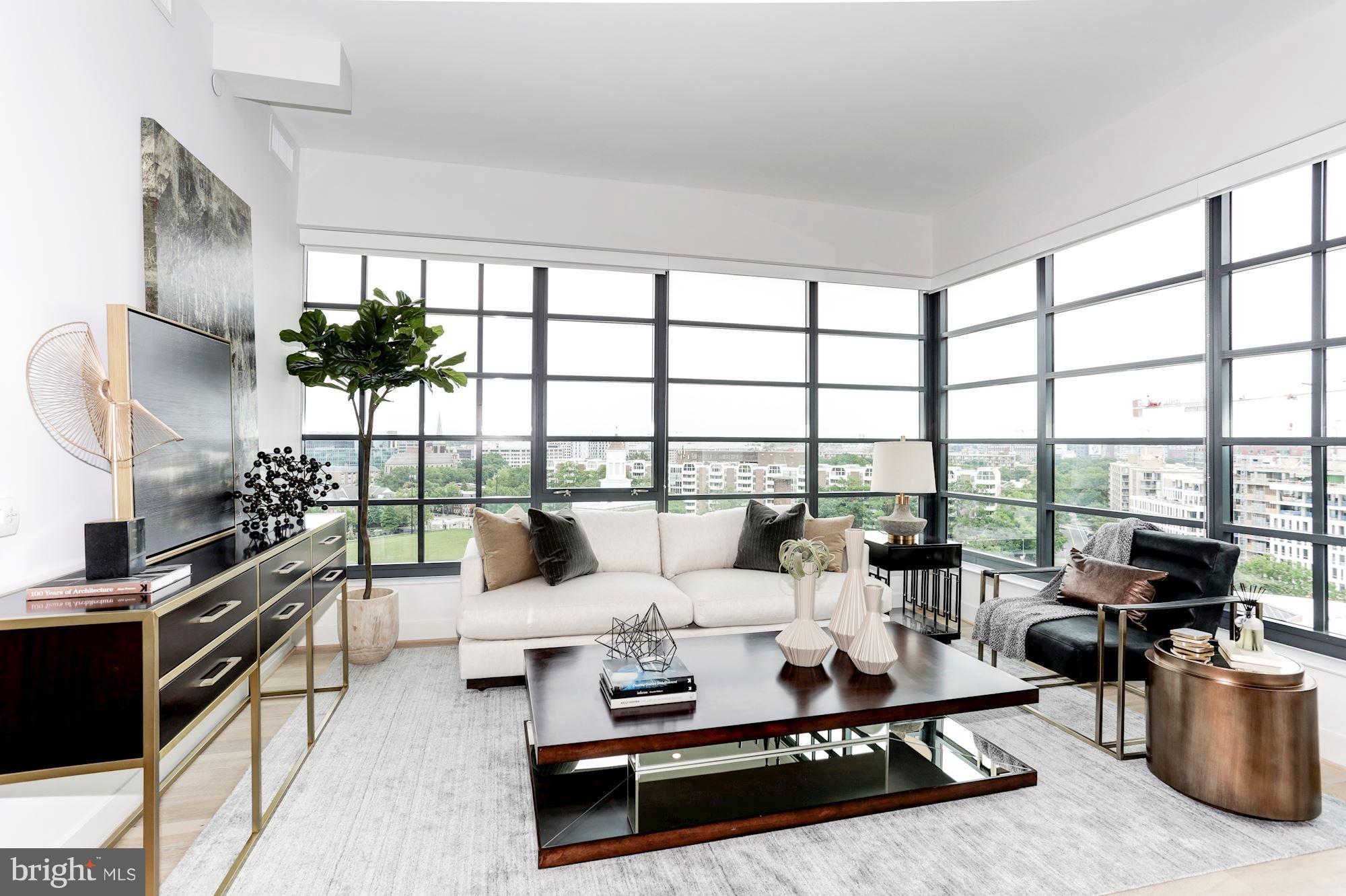 45 Sutton Square Southwest, Unit PH20 Washington, DC 20024 - Photo 3 of 21 a living room with furniture and a flat screen tv
