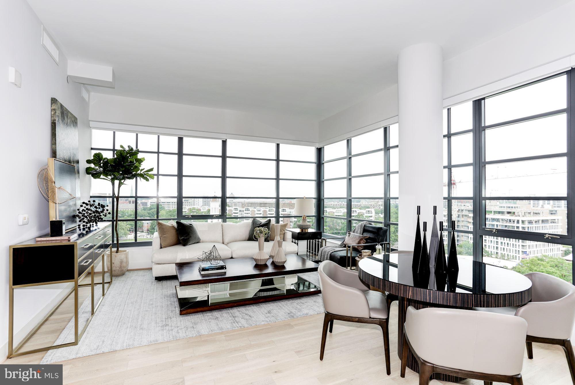 45 Sutton Square Southwest, Unit PH20 Washington, DC 20024 - Photo 4 of 21 a living room with furniture and floor to ceiling window