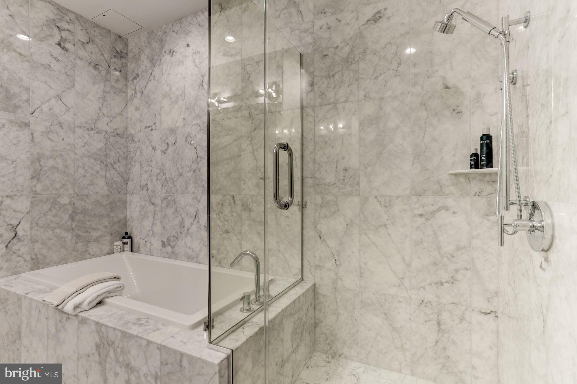 45 Sutton Square Southwest, Unit PH20 Washington, DC 20024 - Photo 9 of 21 a bathroom with a bathtub and shower