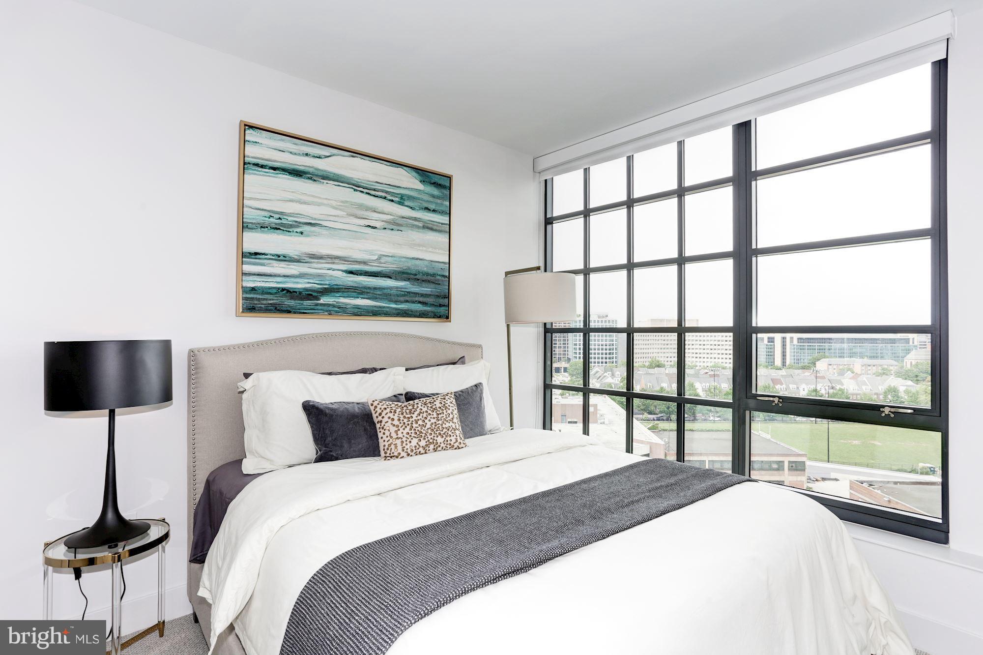 45 Sutton Square Southwest, Unit PH20 Washington, DC 20024 - Photo 10 of 21 a bedroom with a large bed and a large window