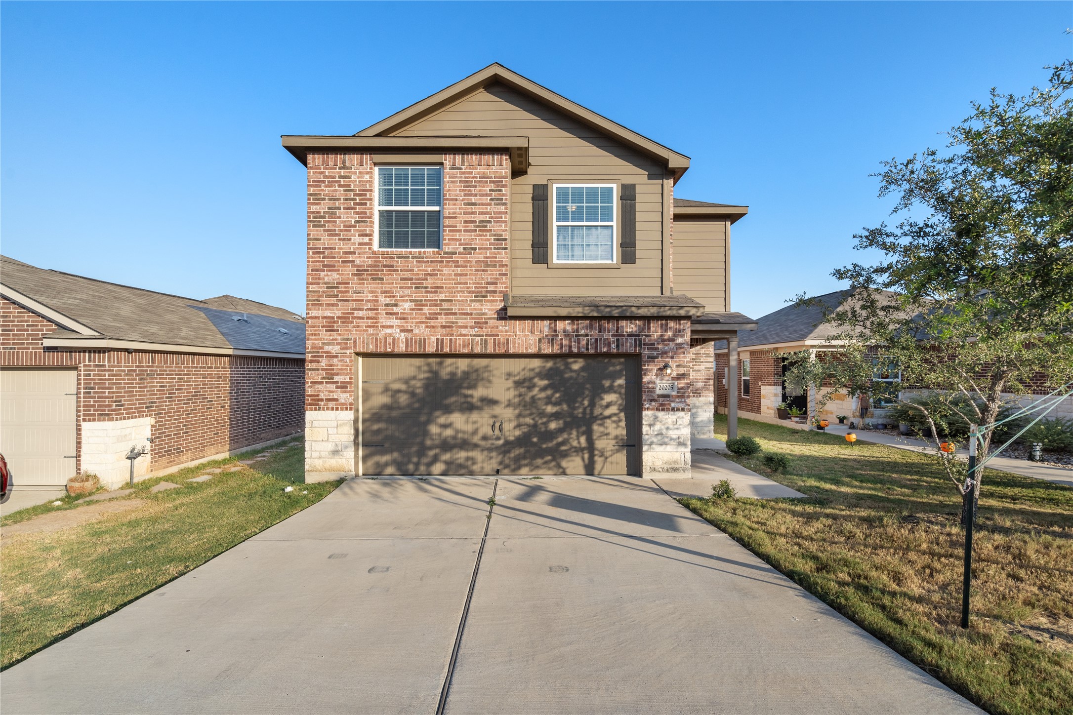 20205 Grover Cleveland Way Manor, TX 78653 - Photo 1 of 26 a view of a house with a yard
