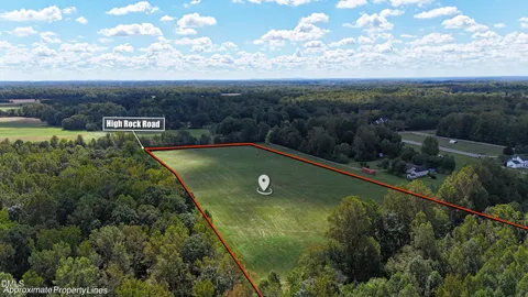 a view of a swimming pool with a yard