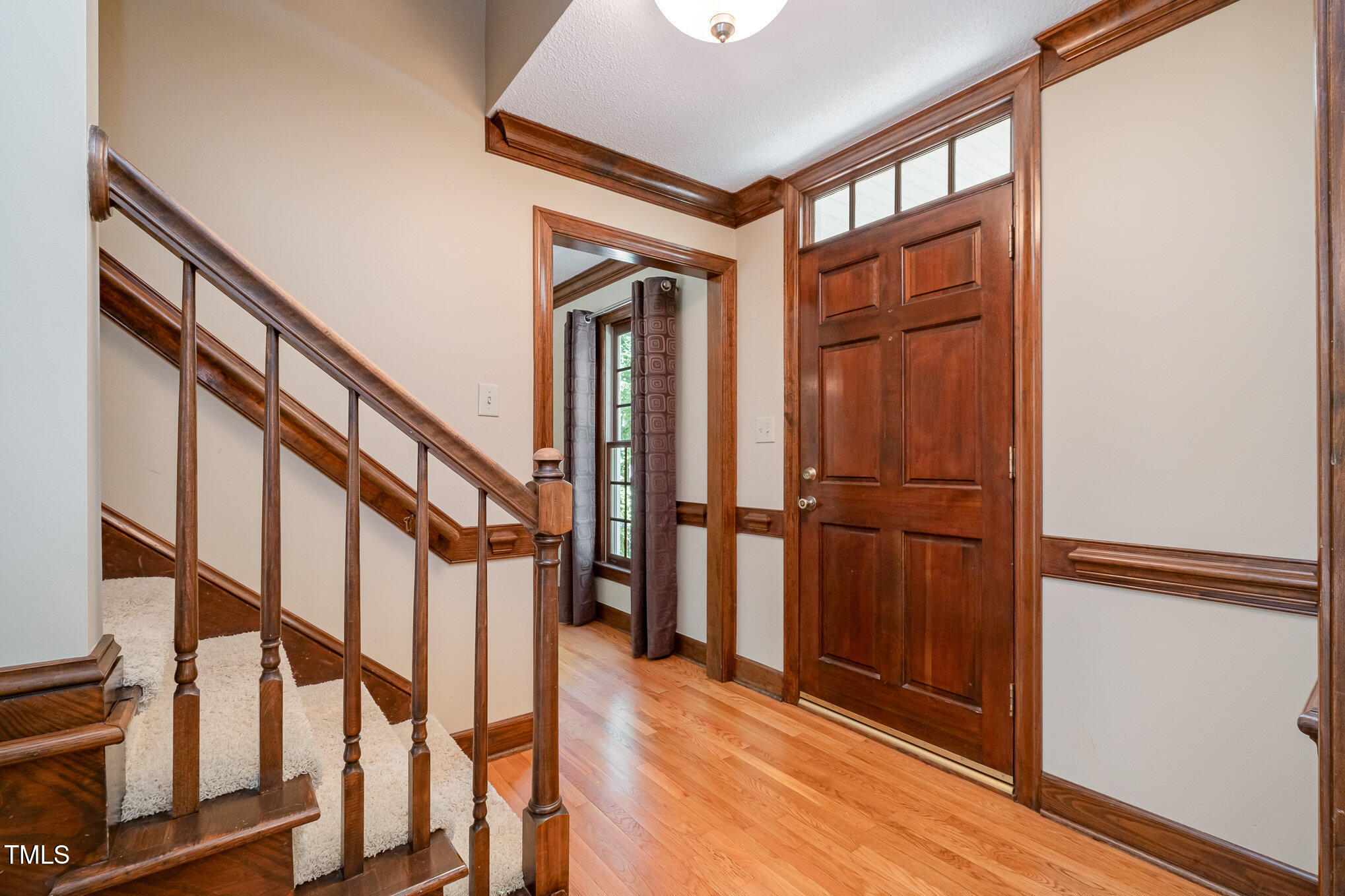103 Donna Place Cary, NC 27513 - Photo 11 of 35 a view of an entryway with wooden floor and door