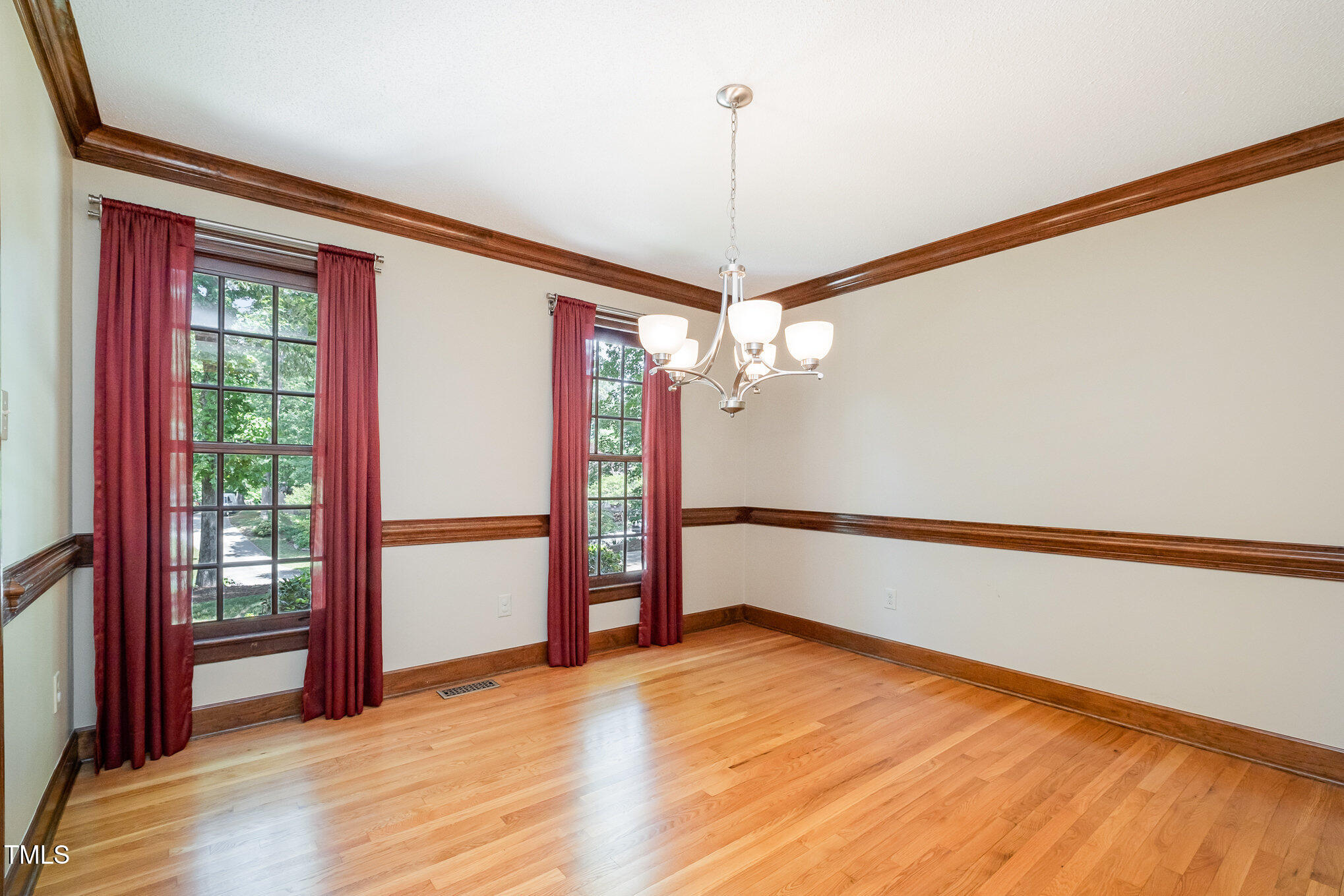 103 Donna Place Cary, NC 27513 - Photo 13 of 35 a view of empty room with wooden floor and fan