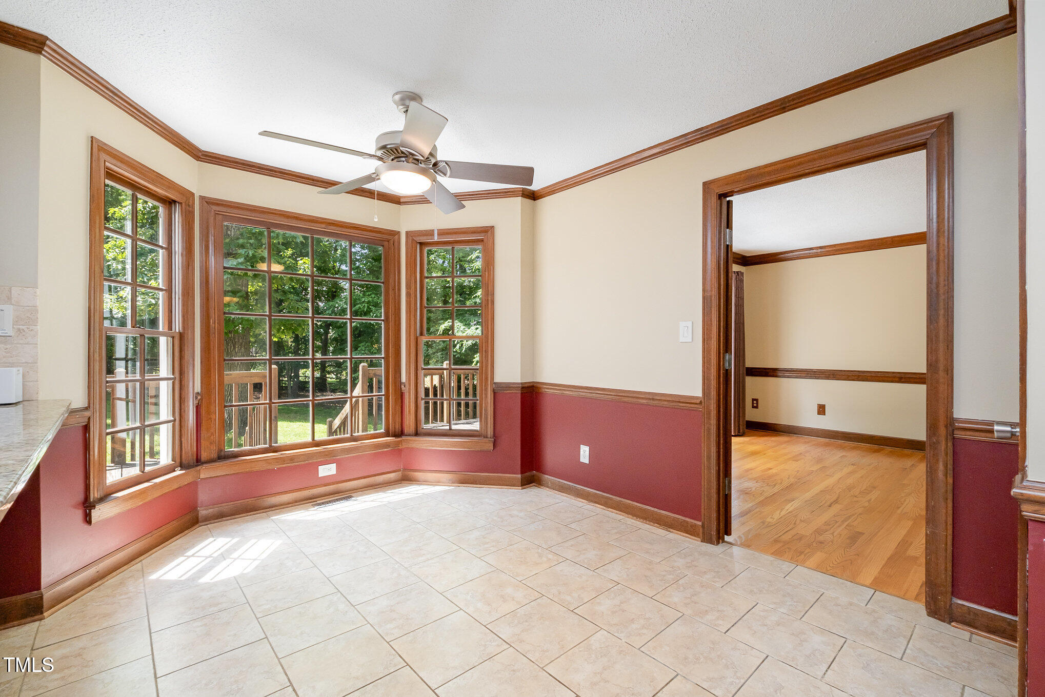 103 Donna Place Cary, NC 27513 - Photo 14 of 35 a view of a livingroom with a ceiling fan and a large window