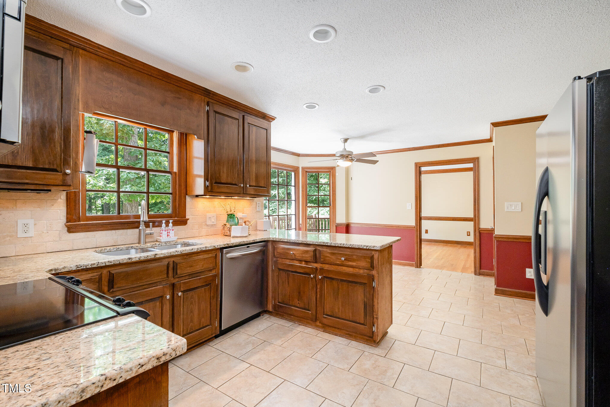 103 Donna Place Cary, NC 27513 - Photo 15 of 35 a kitchen with stainless steel appliances granite countertop a sink and cabinets