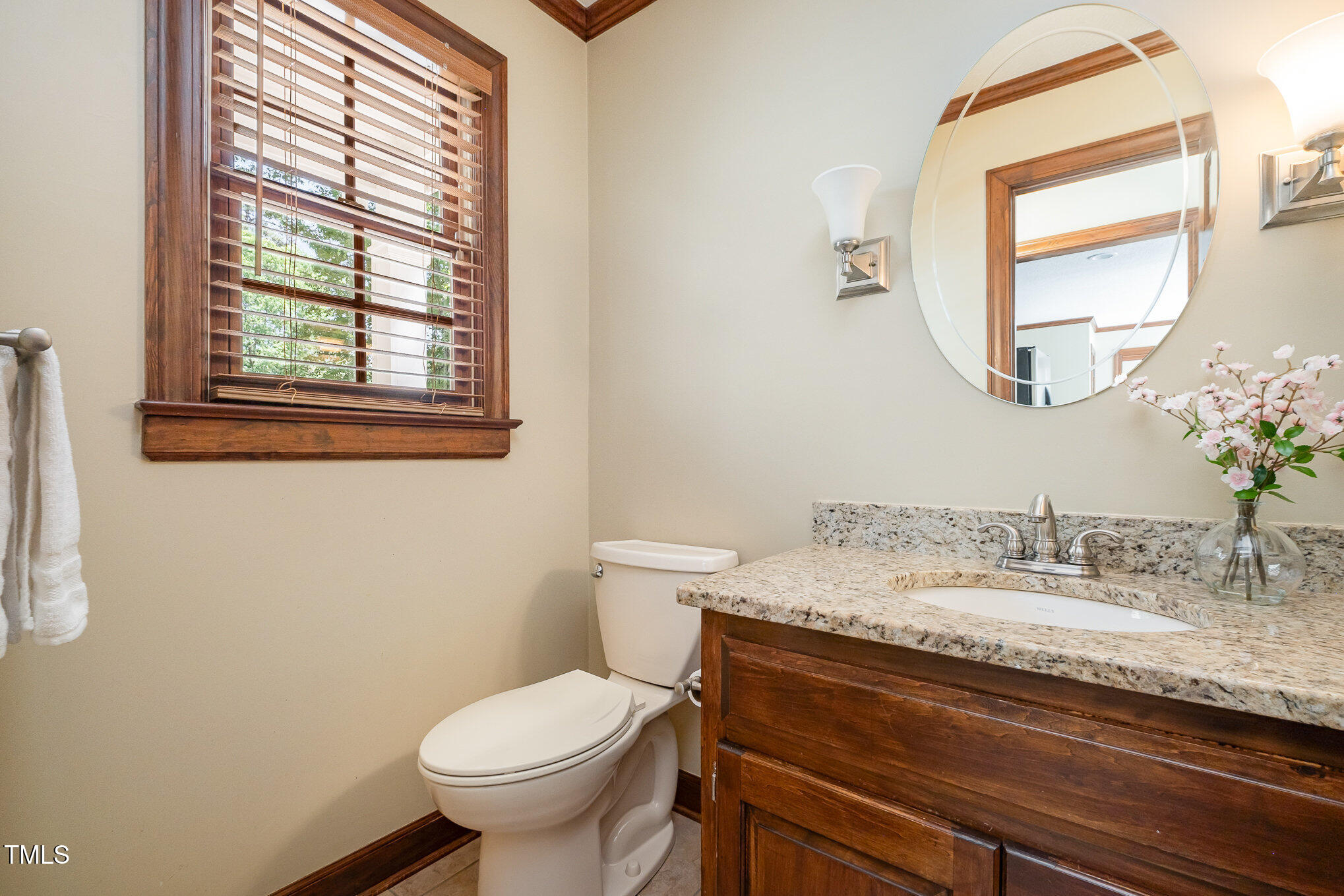 103 Donna Place Cary, NC 27513 - Photo 17 of 35 a bathroom with a granite countertop toilet sink and mirror