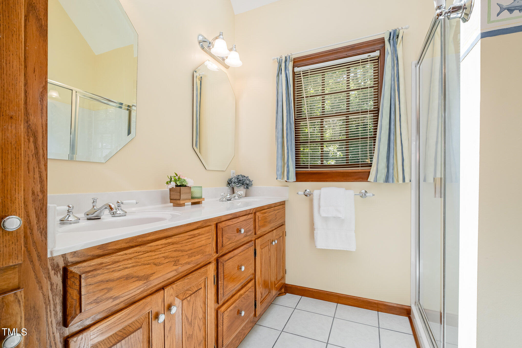 103 Donna Place Cary, NC 27513 - Photo 19 of 35 a bathroom with a sink and a mirror