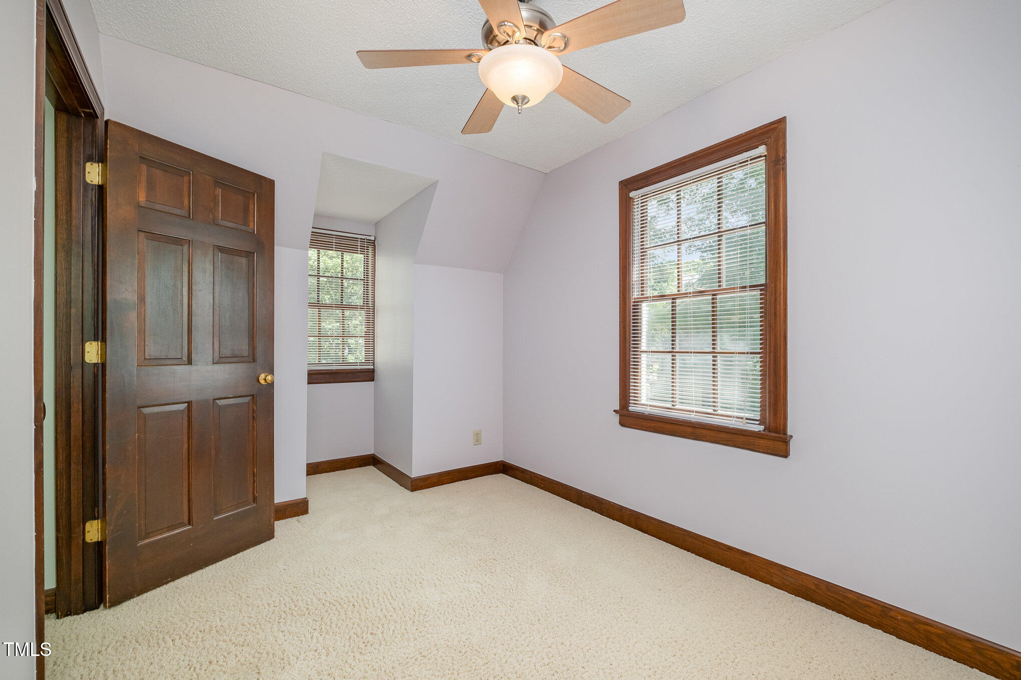 103 Donna Place Cary, NC 27513 - Photo 21 of 35 an empty room with windows and fan
