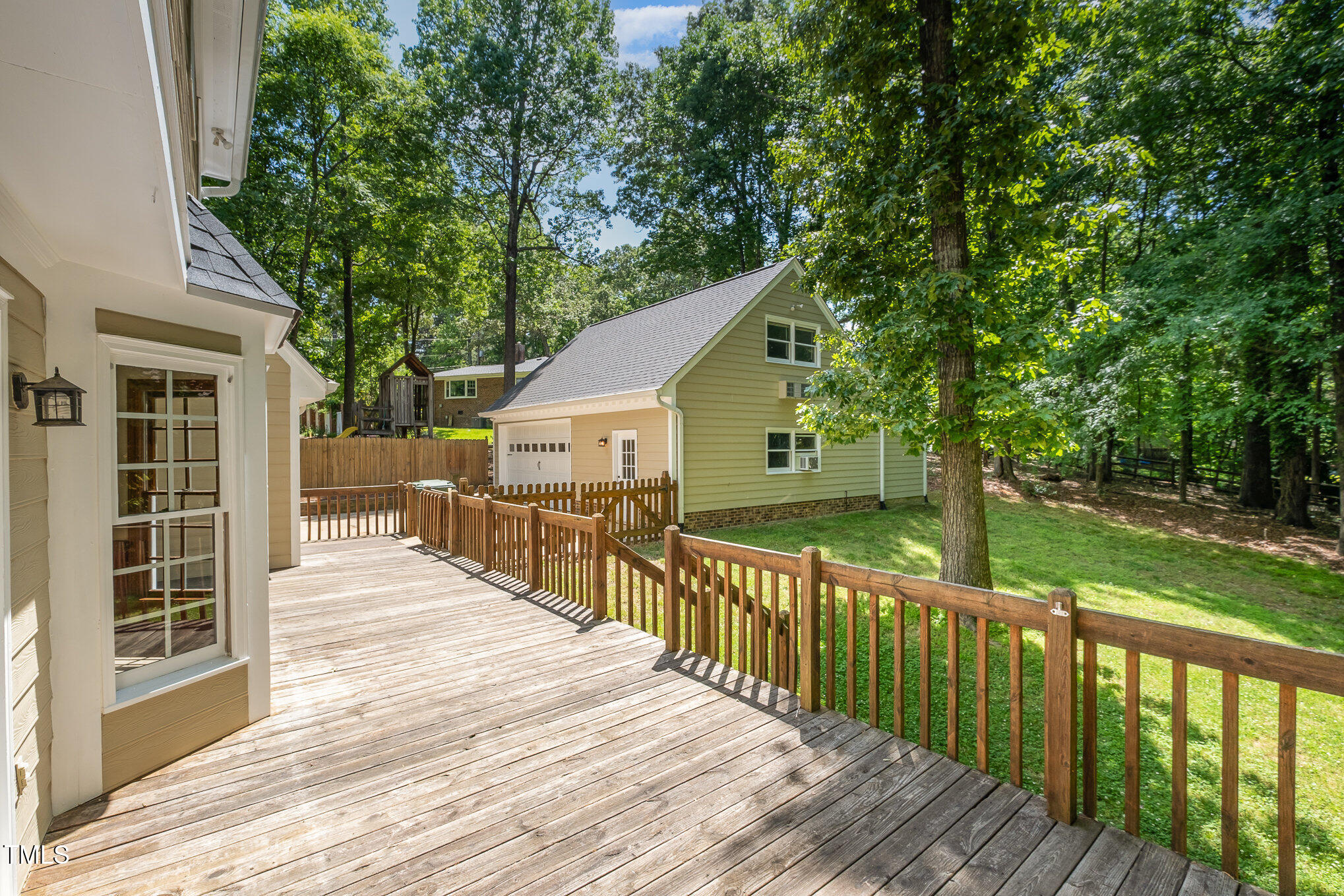 103 Donna Place Cary, NC 27513 - Photo 25 of 35 a view of a house with backyard and sitting area