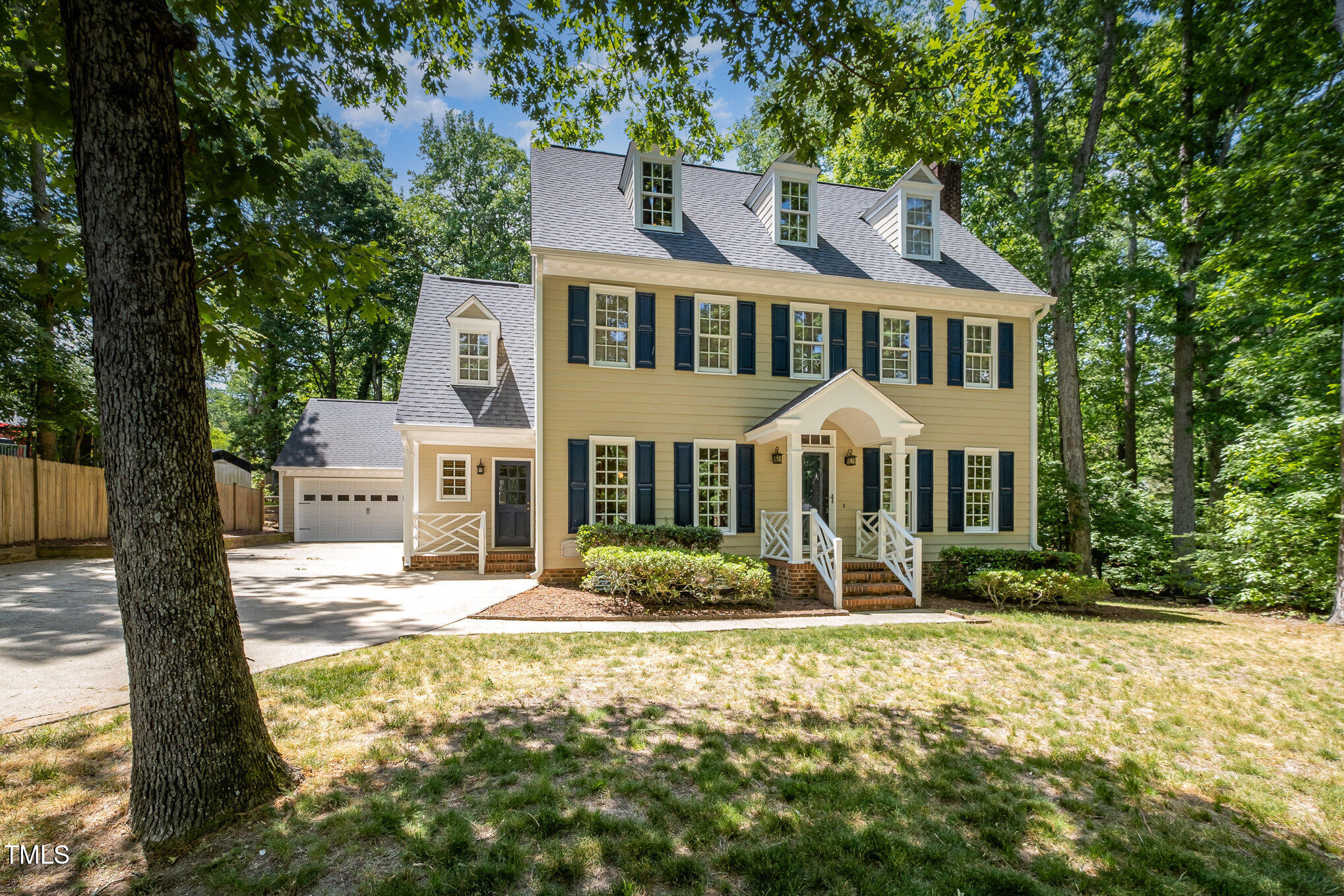 103 Donna Place Cary, NC 27513 - Photo 32 of 35 a front view of a house with garden