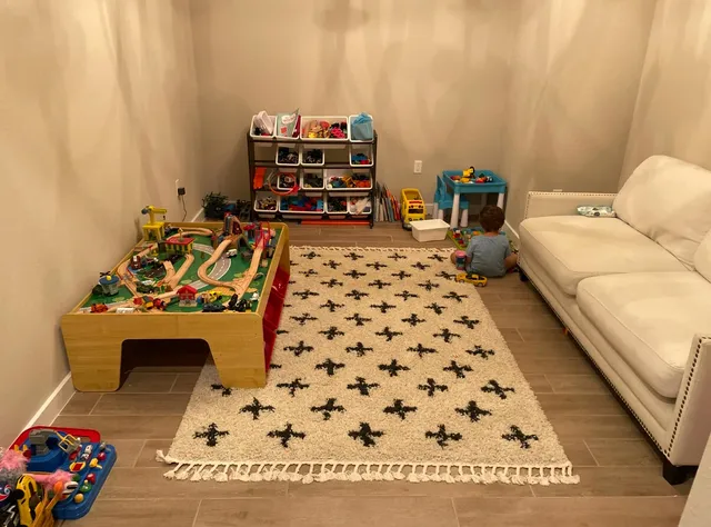 a bedroom with a bed and a couch