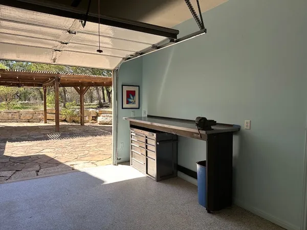 a view of a room with wooden floor and windows