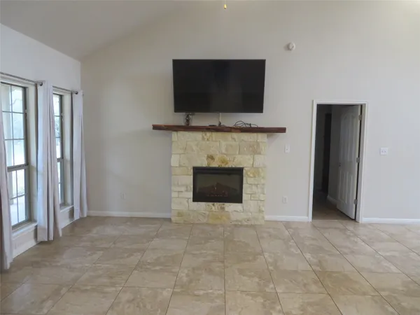 a view of a room with window and wooden floor