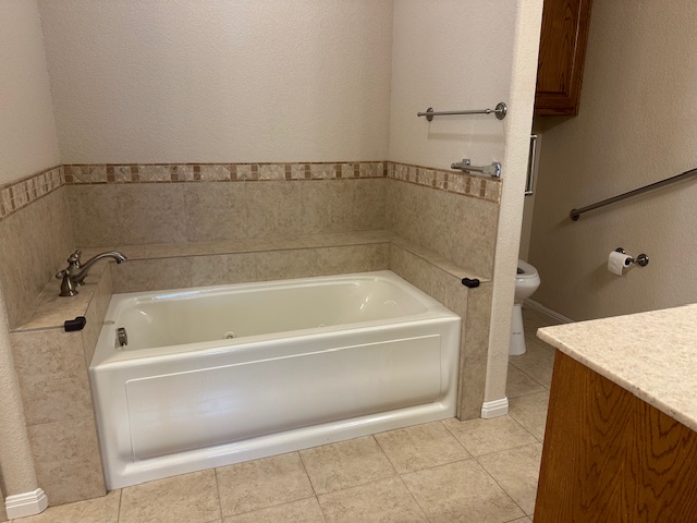 1761 Cottonwood Road Fischer, TX 78623 - Photo 24 of 29 a bathroom with a bathtub