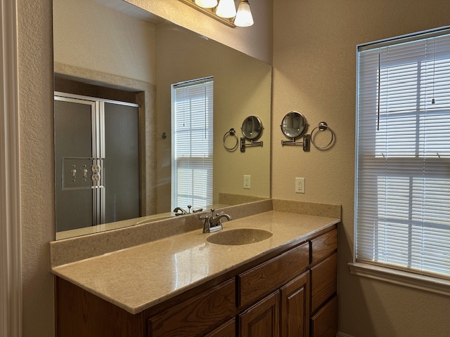 1761 Cottonwood Road Fischer, TX 78623 - Photo 25 of 29 a bathroom with a sink and a mirror