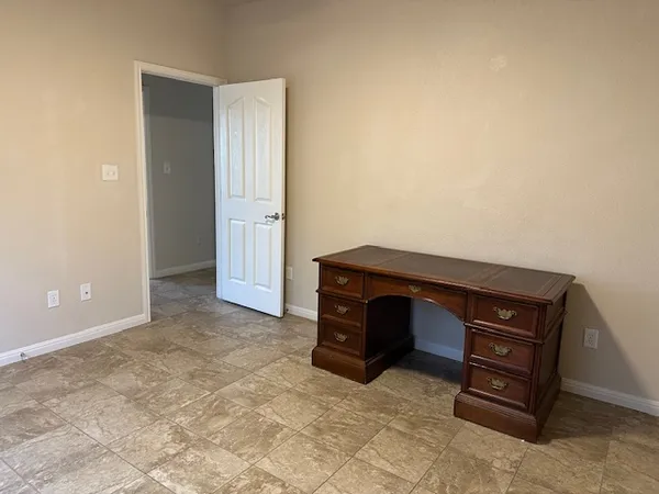 a bathroom with a tub and shower