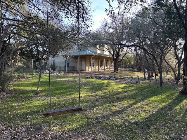 1761 Cottonwood Road Fischer, TX 78623 - Photo 4 of 29 a view of a house with a backyard
