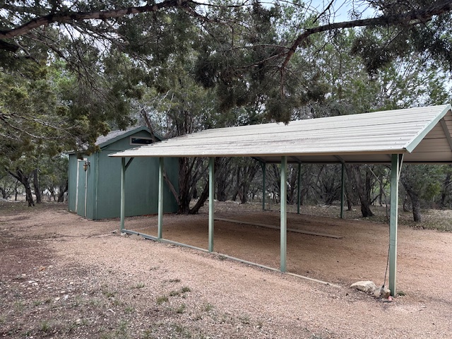 1761 Cottonwood Road Fischer, TX 78623 - Photo 8 of 29 a backyard of a house with table and chairs