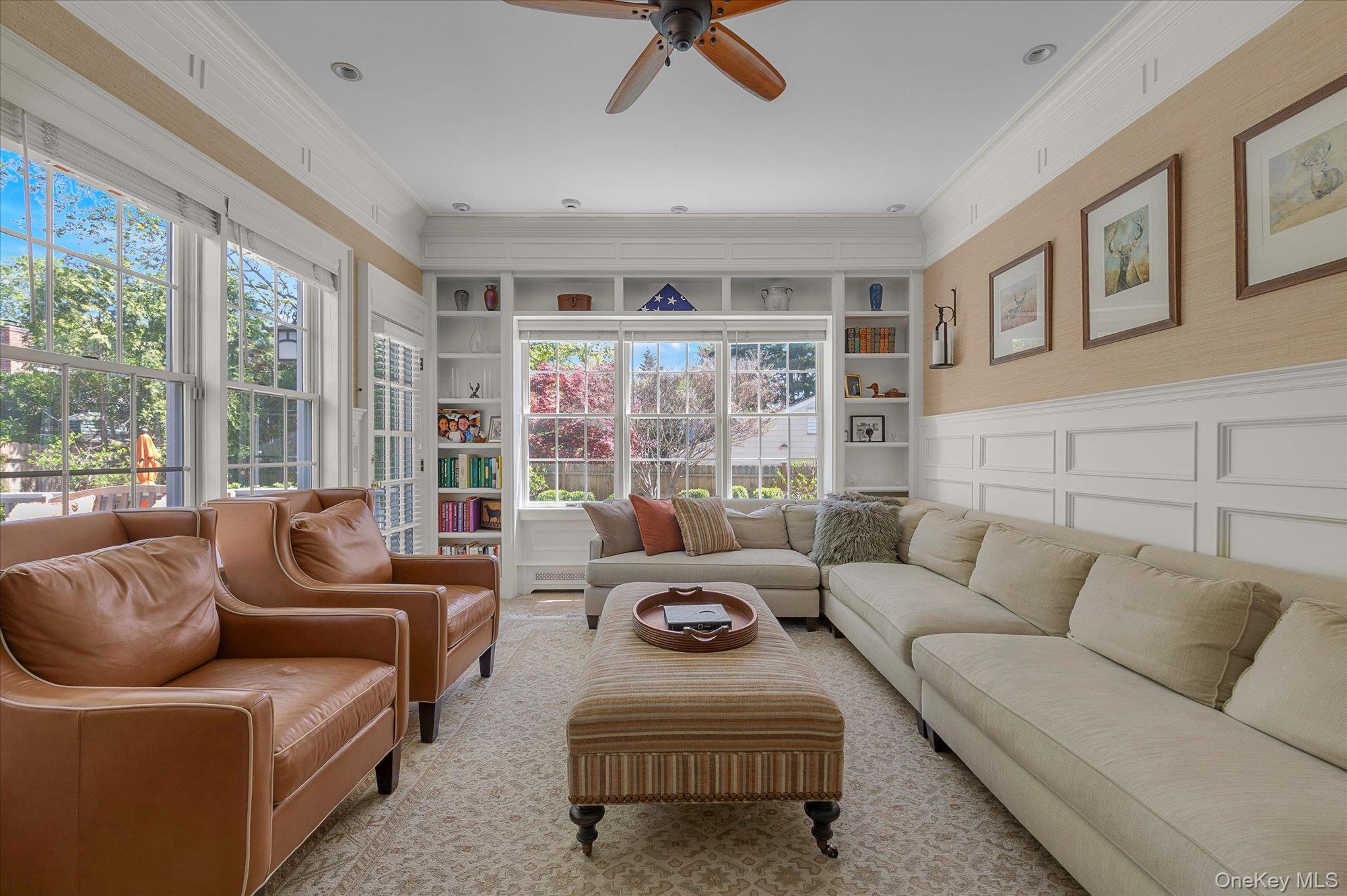 6 Maple Avenue Locust Valley, NY 11560 - Photo 11 of 21 a living room with furniture and a floor to ceiling window