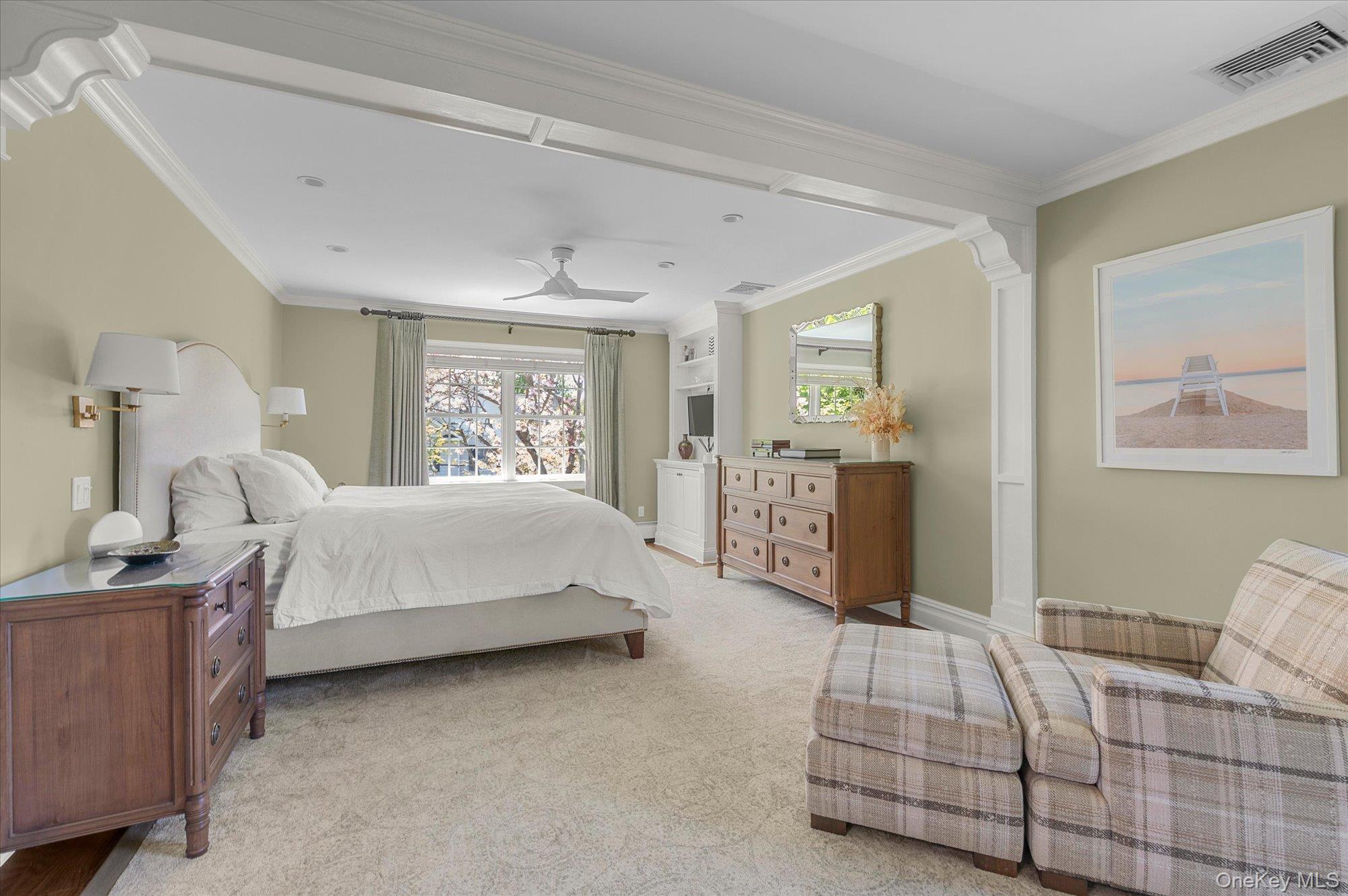 6 Maple Avenue Locust Valley, NY 11560 - Photo 12 of 21 a spacious bedroom with a bed and cabinet