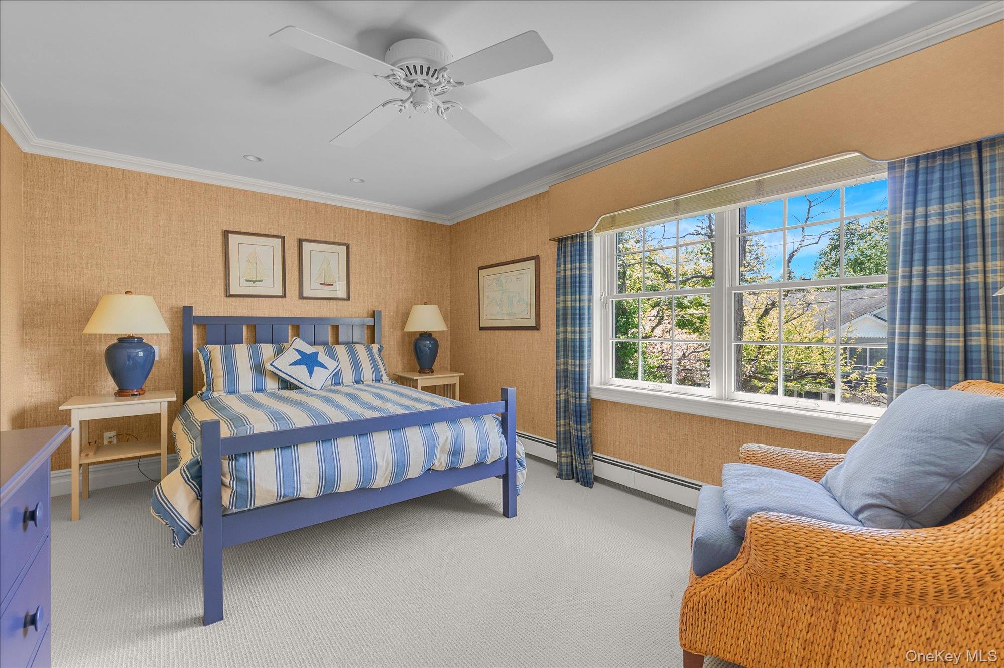 6 Maple Avenue Locust Valley, NY 11560 - Photo 15 of 21 a bedroom with a bed and a couch
