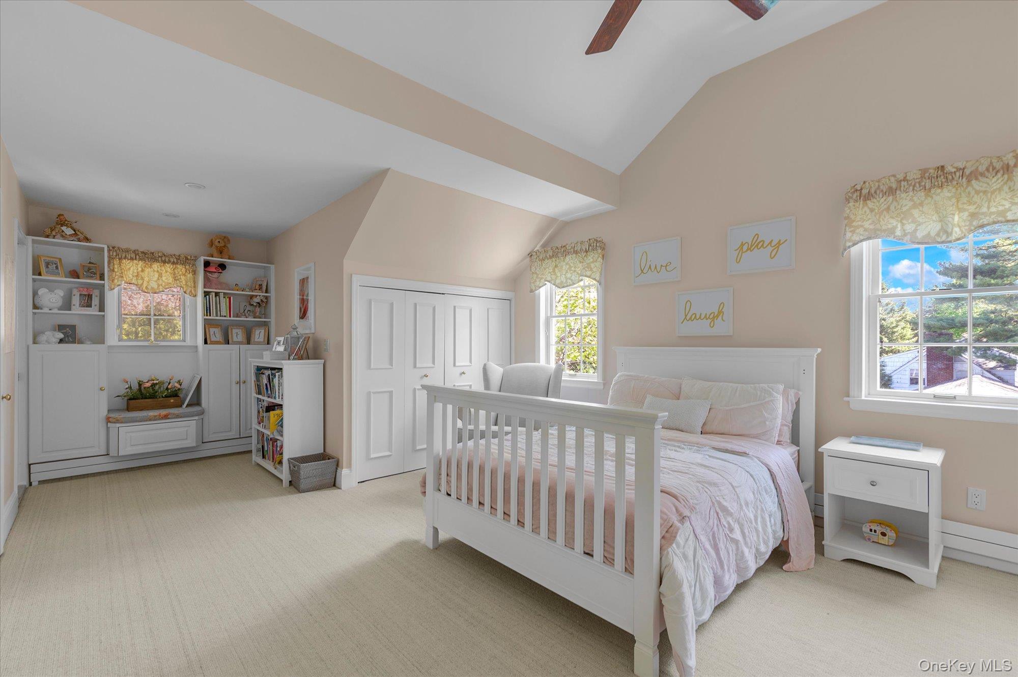 6 Maple Avenue Locust Valley, NY 11560 - Photo 16 of 21 a bedroom with a bed and a window