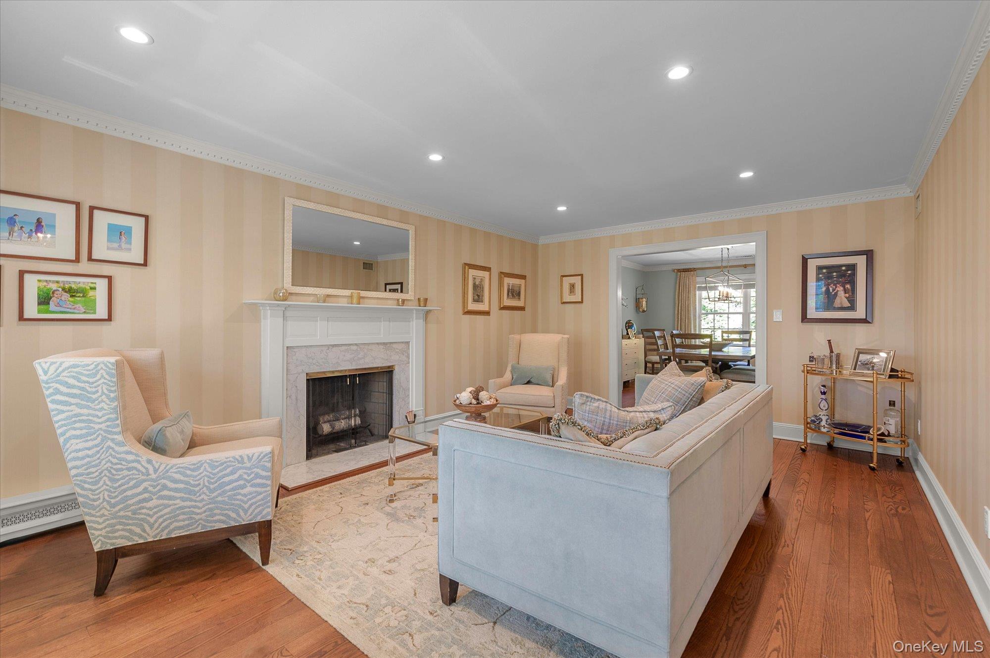 6 Maple Avenue Locust Valley, NY 11560 - Photo 3 of 21 a living room with furniture and a fireplace