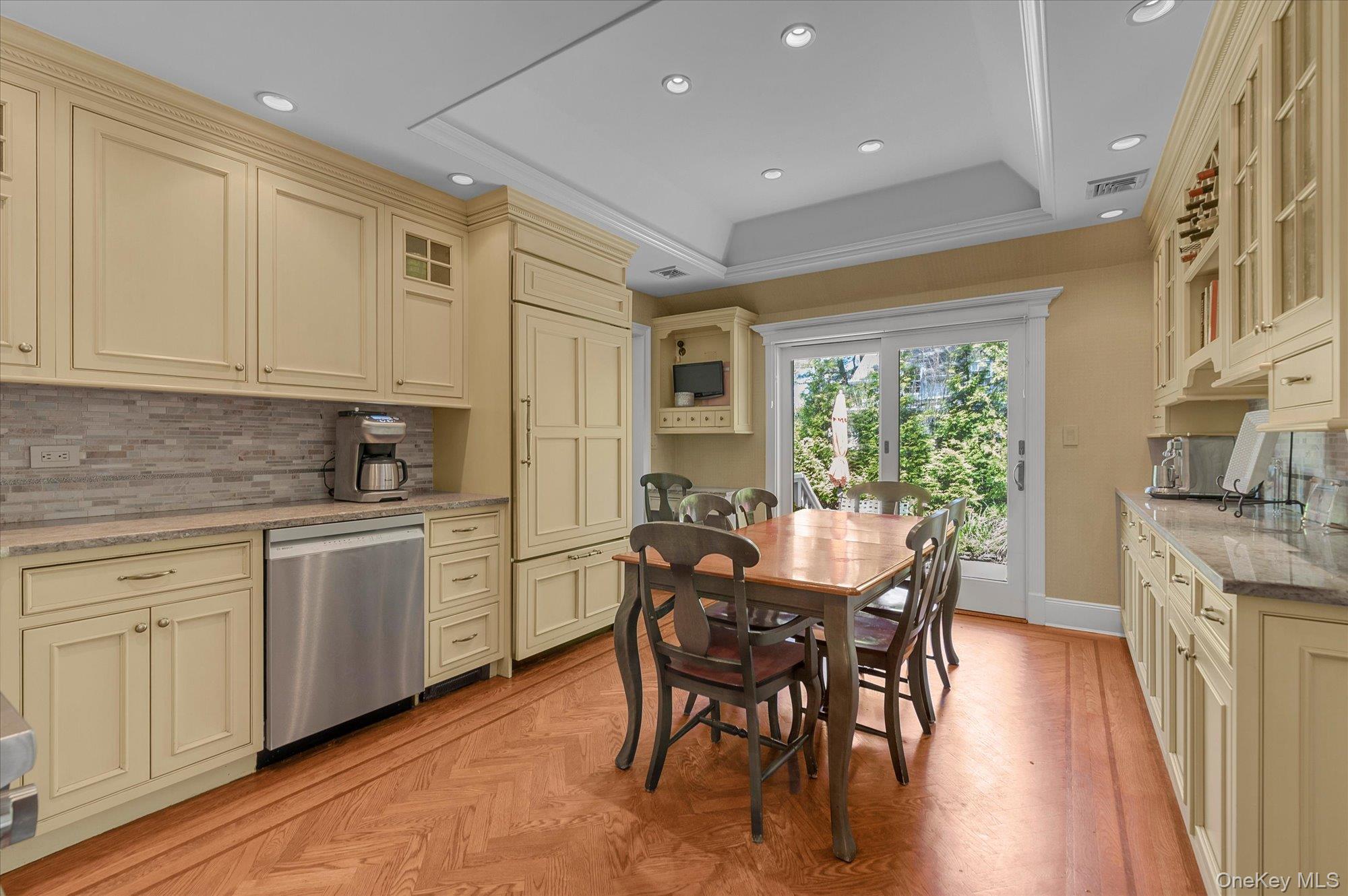 6 Maple Avenue Locust Valley, NY 11560 - Photo 6 of 21 a kitchen with granite countertop white cabinets and wooden floor