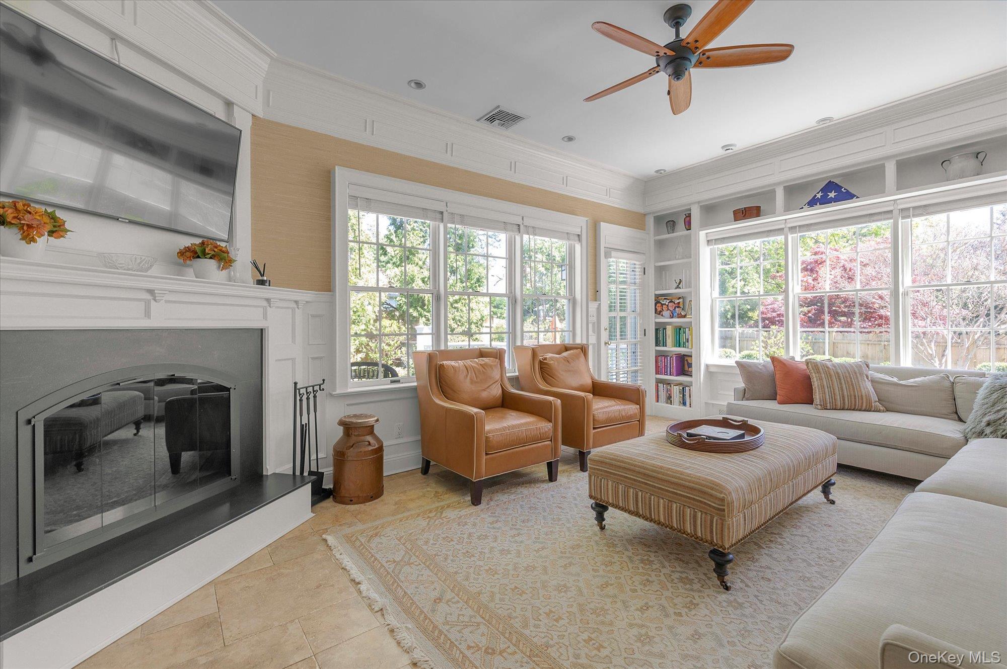 6 Maple Avenue Locust Valley, NY 11560 - Photo 10 of 21 a living room with furniture and a fireplace