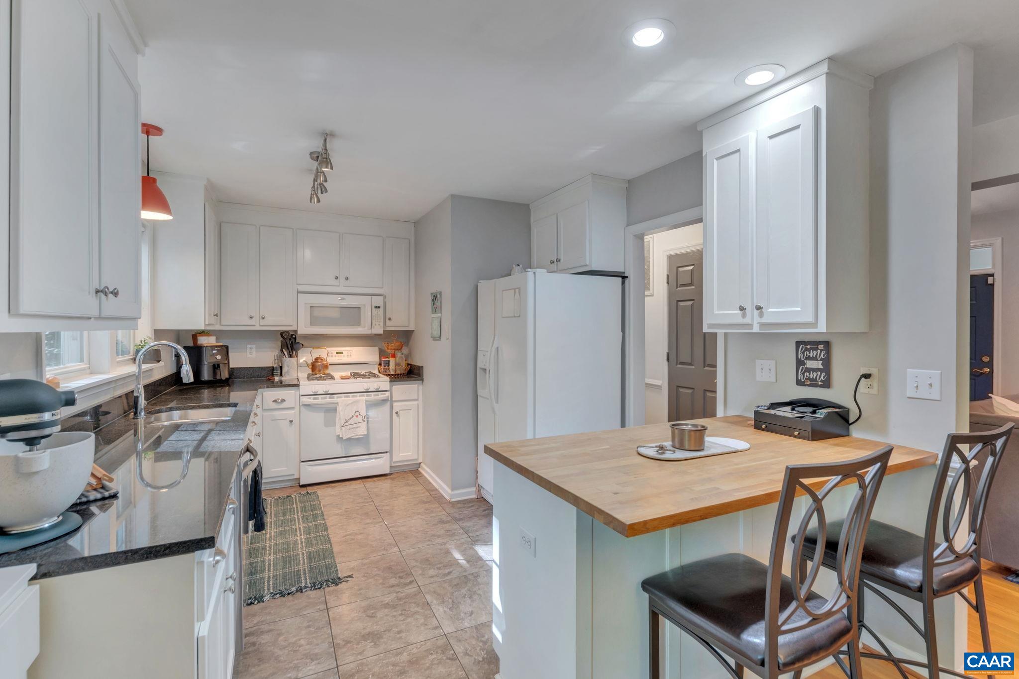 9 Colonial Road Palmyra, VA 22963 - Photo 13 of 49 a kitchen with a stove a refrigerator and a sink
