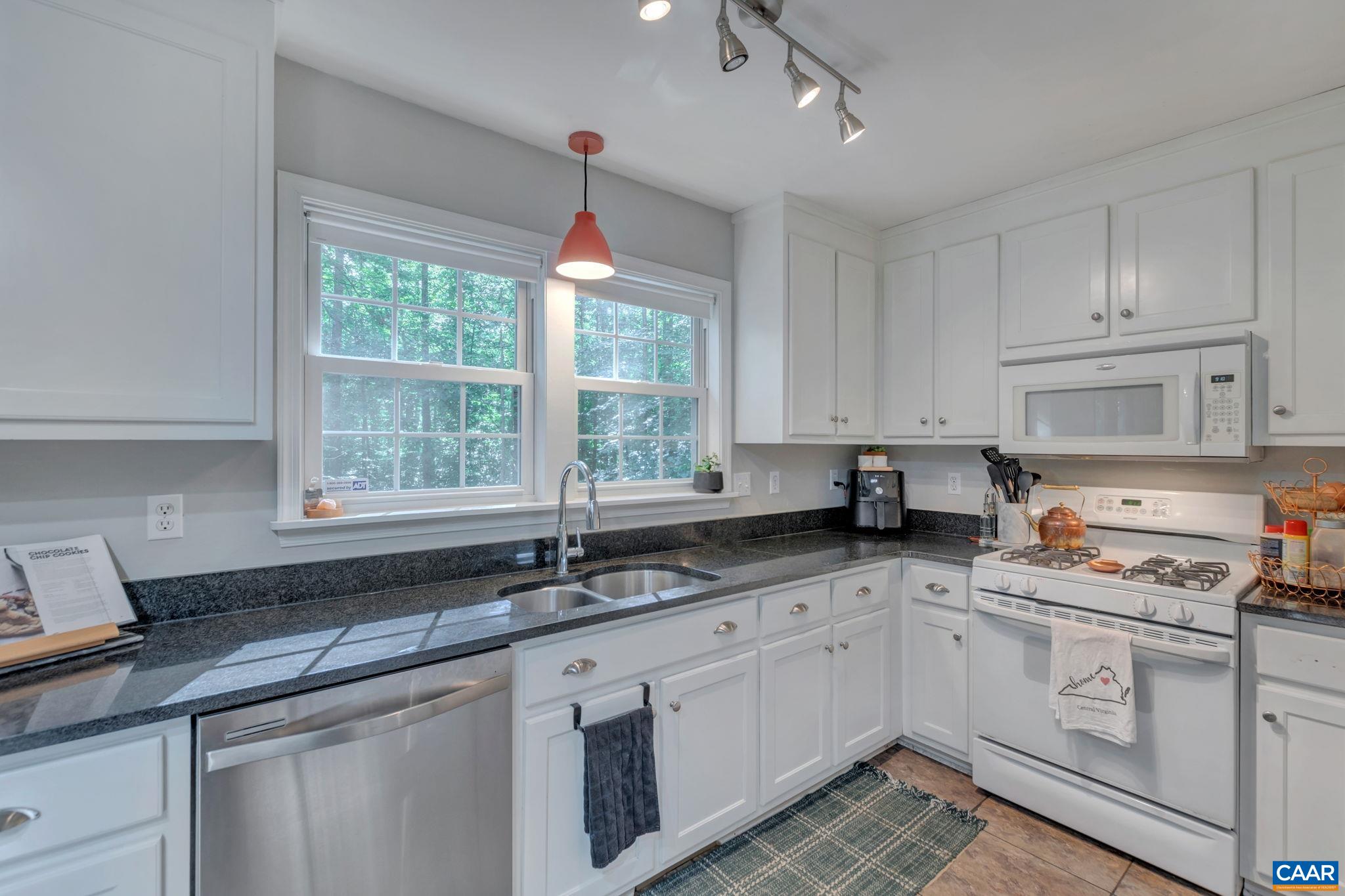 9 Colonial Road Palmyra, VA 22963 - Photo 16 of 49 a kitchen with a sink window and cabinets