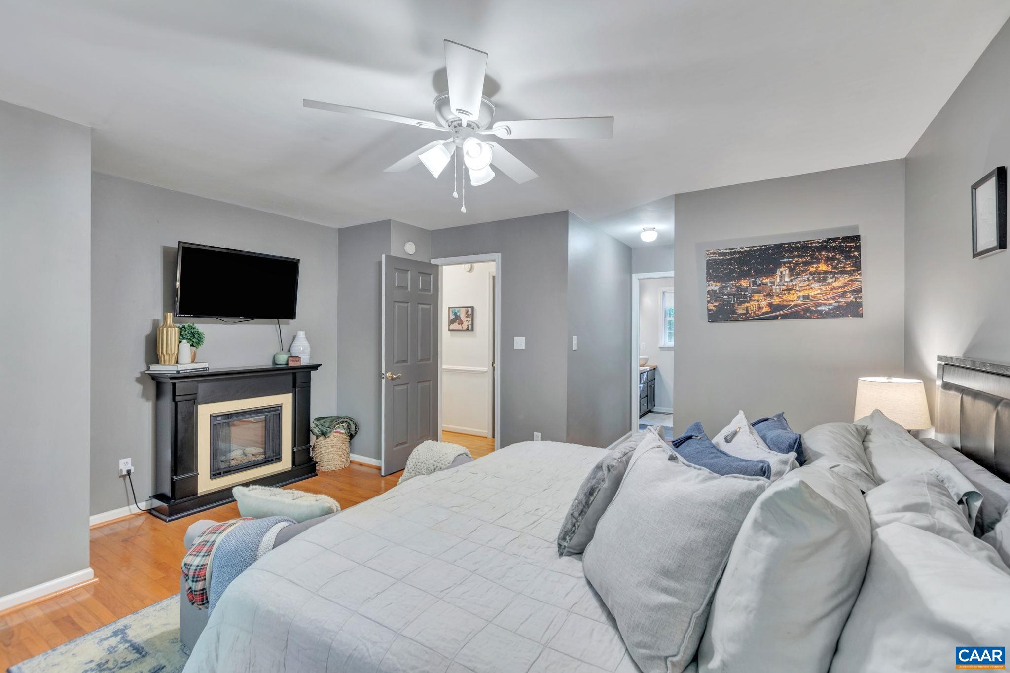 9 Colonial Road Palmyra, VA 22963 - Photo 20 of 49 a bedroom with a bed and a flat screen tv